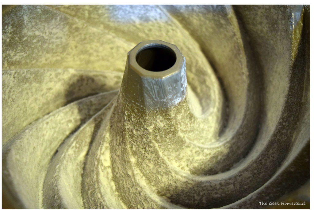 Floured bundt pan before tapping