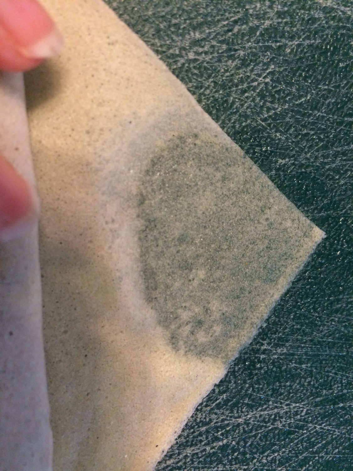 Wet the top of the triangle and roll it up!